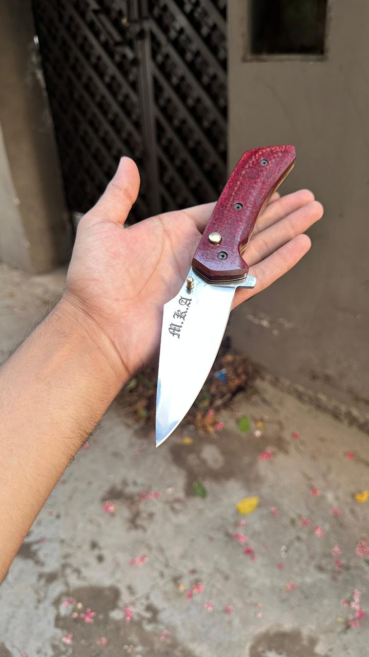 Huker - Handmade high carbon steel button lock folder