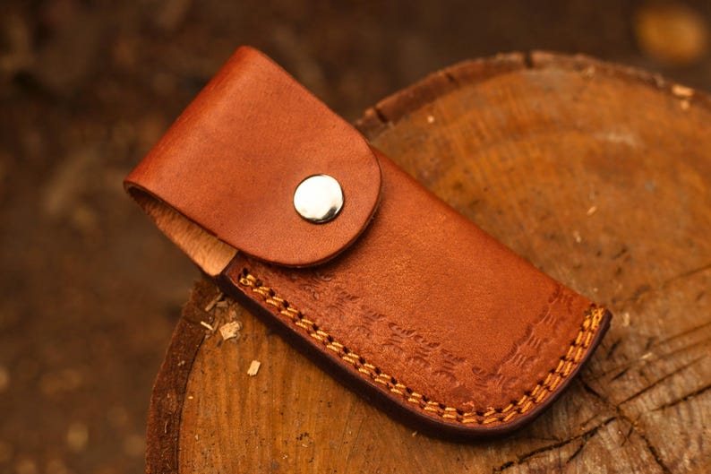 The FinBlade – Damascus Folding Knife with Fish Bone Handle
